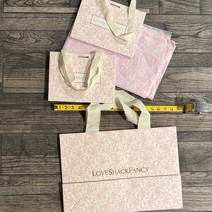 3 love shack fancy gift bags and tissue paper